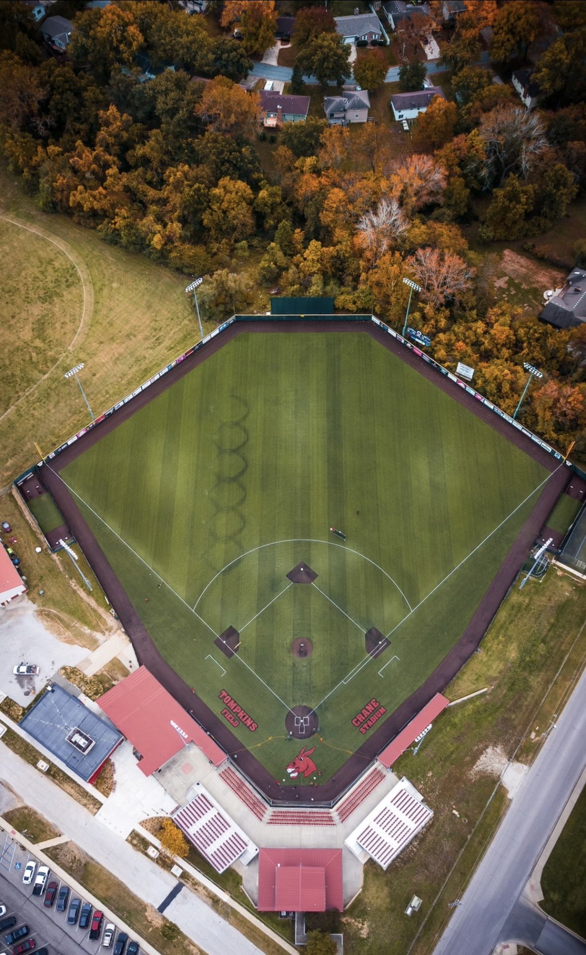 Overhead view of Crane Stadium and Tompkins Field with fall trees beyond the outfield