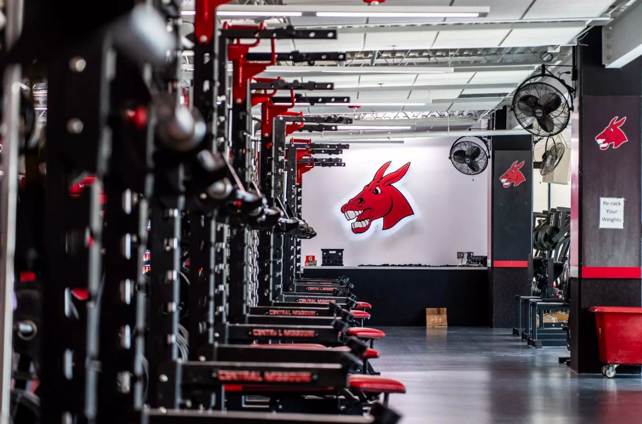 Rows of racks in the Mules weight room